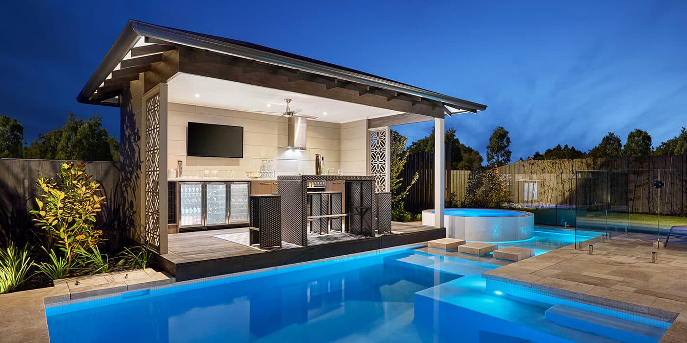 Swimming pool landscaping with paved outdoor entertaining area and pavilion by Creative Image Landscapes